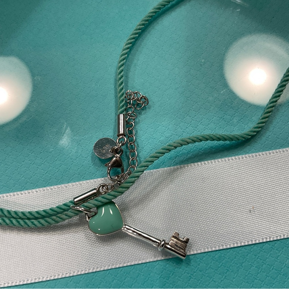 Tiffany blue silk necklace and key